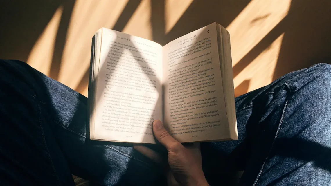 how to become a morning person: soft morning sunlight streaming through sheer curtains onto a wooden table