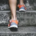 walking routine for beginners: comfortable walking sneakers on a sunlit paved neighborhood park path